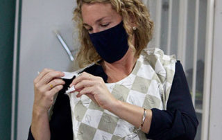 nurse demonstrating a newgown prototype